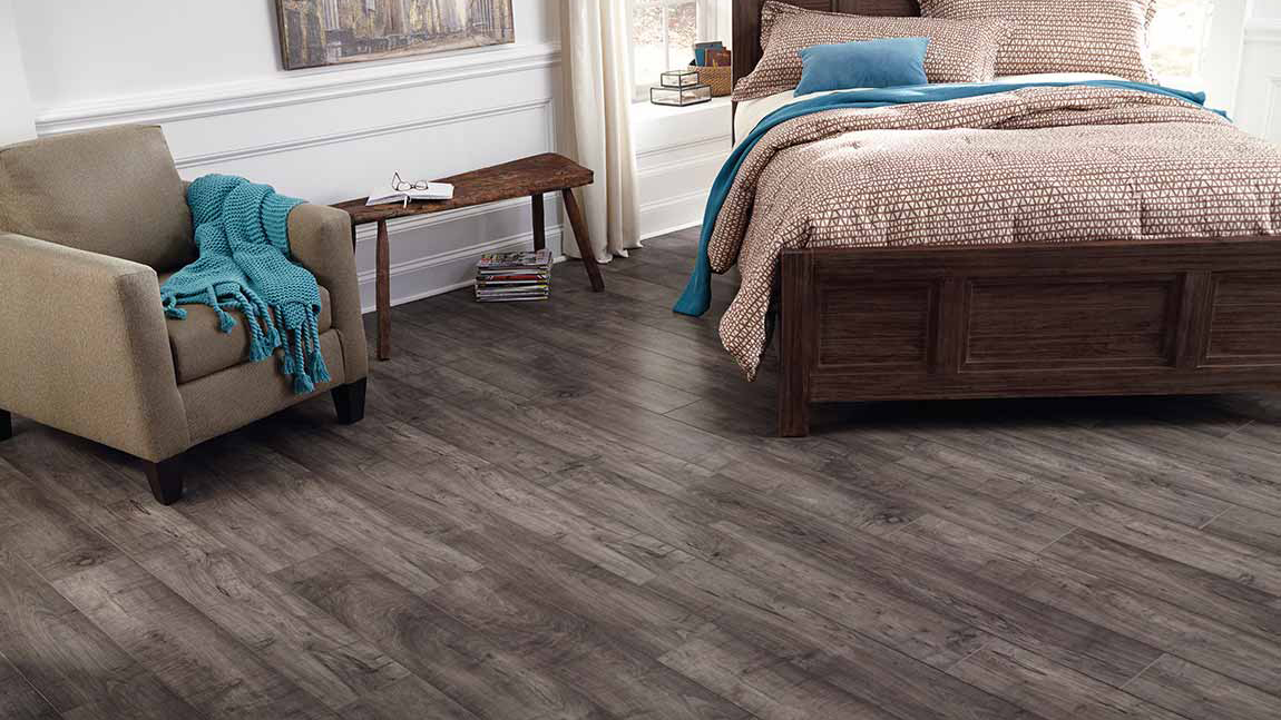 Brooks Range Sierra by Floorcraft, wood-look laminate floor in bedroom. 